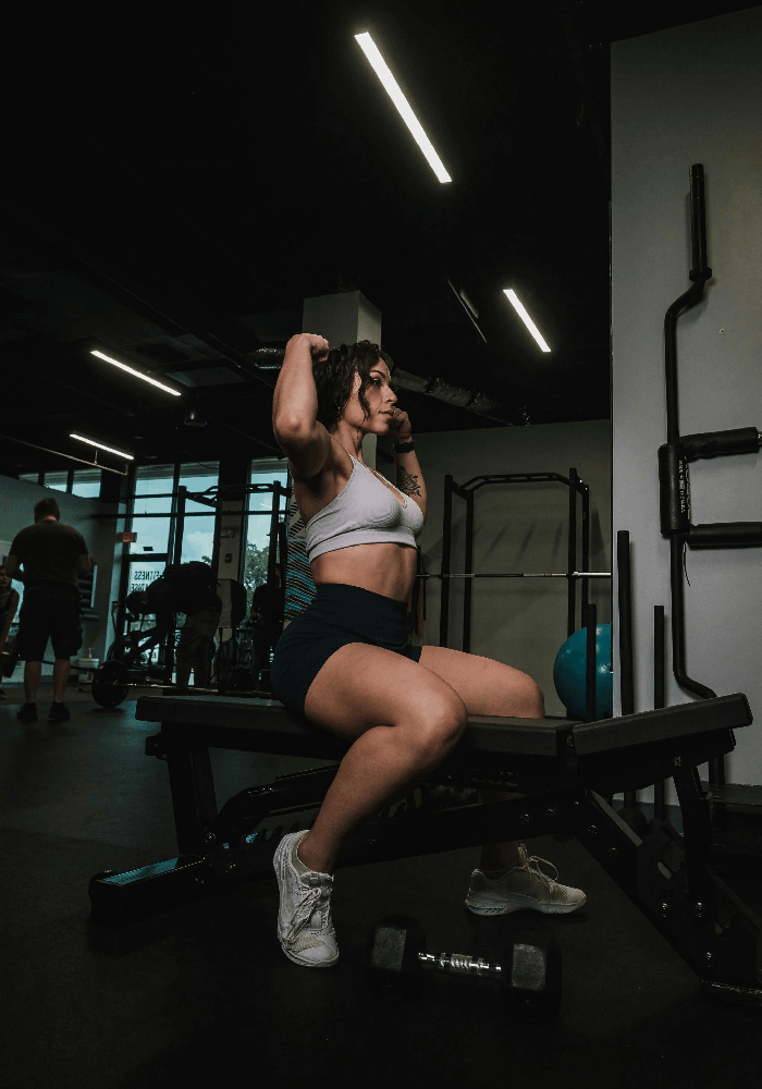 woman-doing-exercise-on-a-machine-in-a-gym